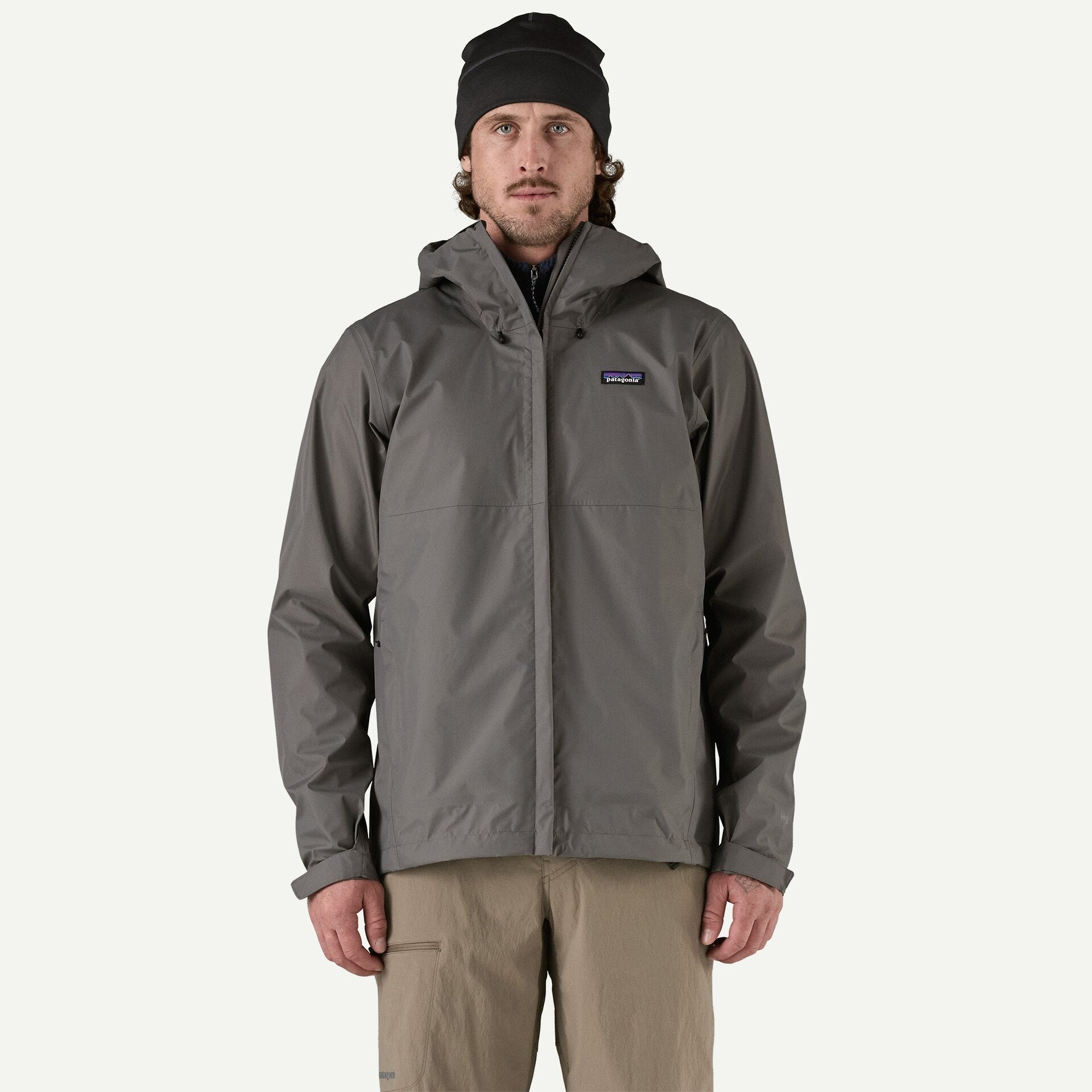 Men's waterproof rain jacket in gray, front view, with hood and chest logo patch