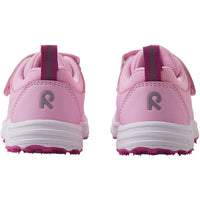 Pink children's athletic sneakers with velcro straps and textured soles, rear view