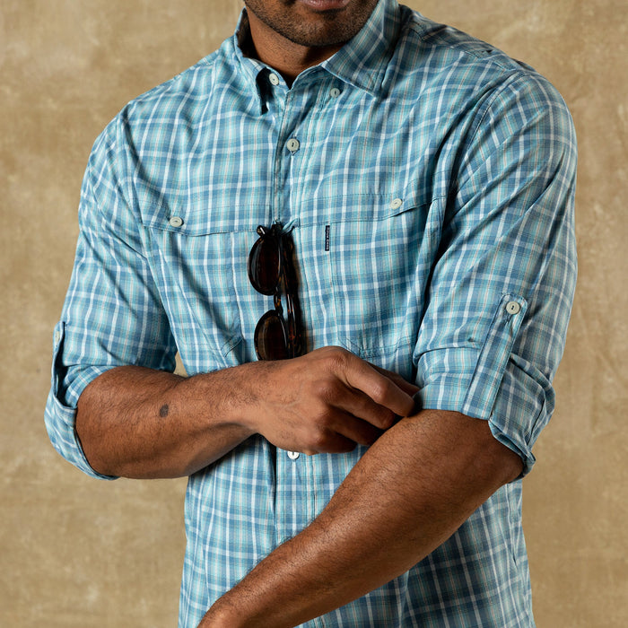 Light blue plaid button-down shirt with rolled sleeves, front view on model