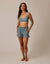 Black and white checkered shorts with drawstring waist and side pockets worn by model