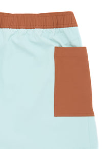 Women's athletic shorts with elastic waistband and side pocket in mint green and terracotta colorblock