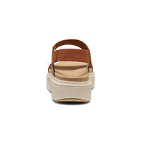 Brown platform sandal with adjustable straps and textured sole, rear view