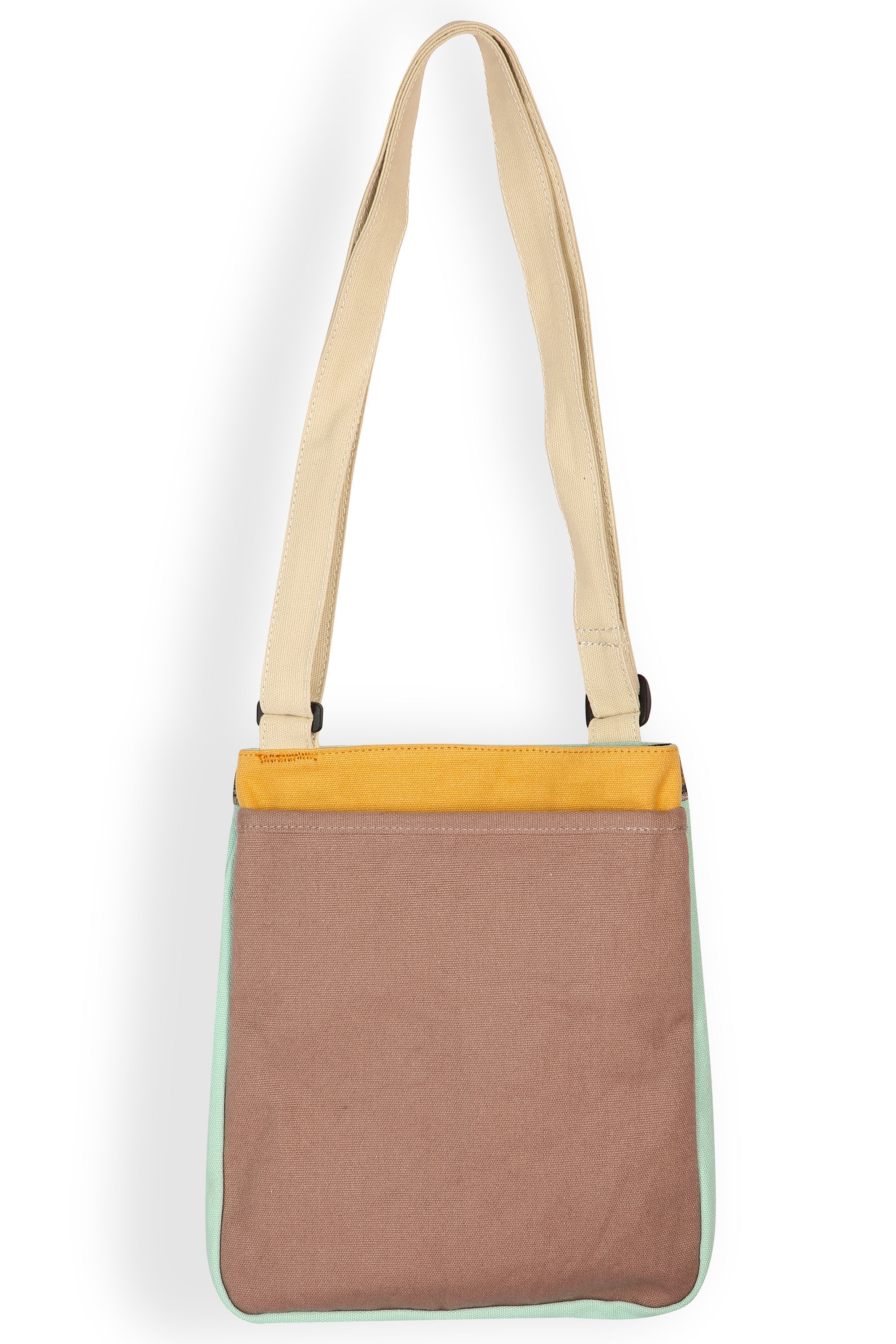 Cross-body bag with adjustable strap featuring colorful blocked pattern in pastel tones