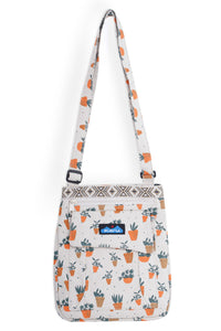 Small crossbody bag with plant pot pattern and adjustable strap on white background