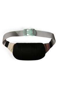 Fanny pack with black mesh front, colorblock panels, and gray adjustable strap with green buckle
