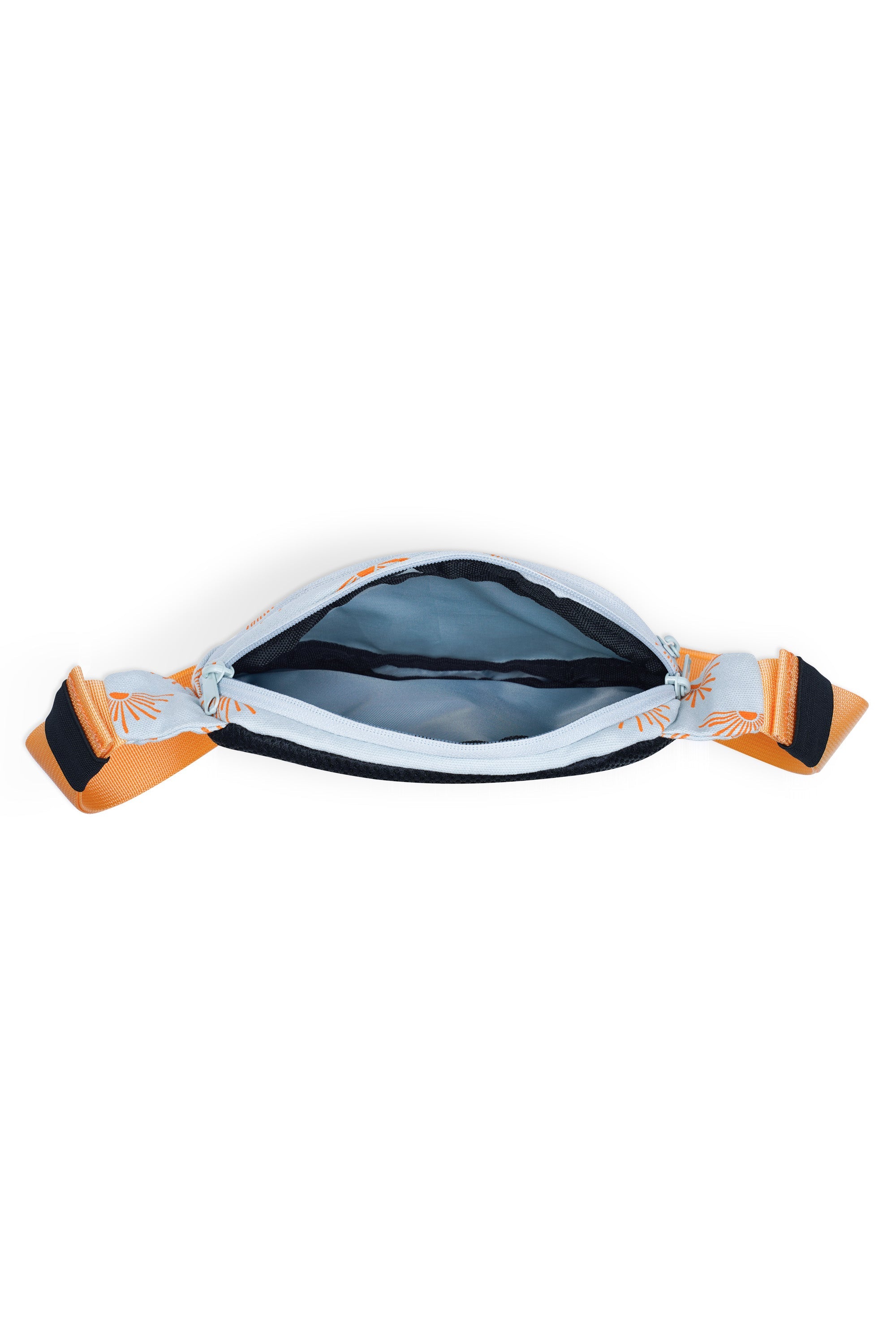 Canvas crossbody bag with tropical pattern, orange straps, shown open to reveal interior compartment