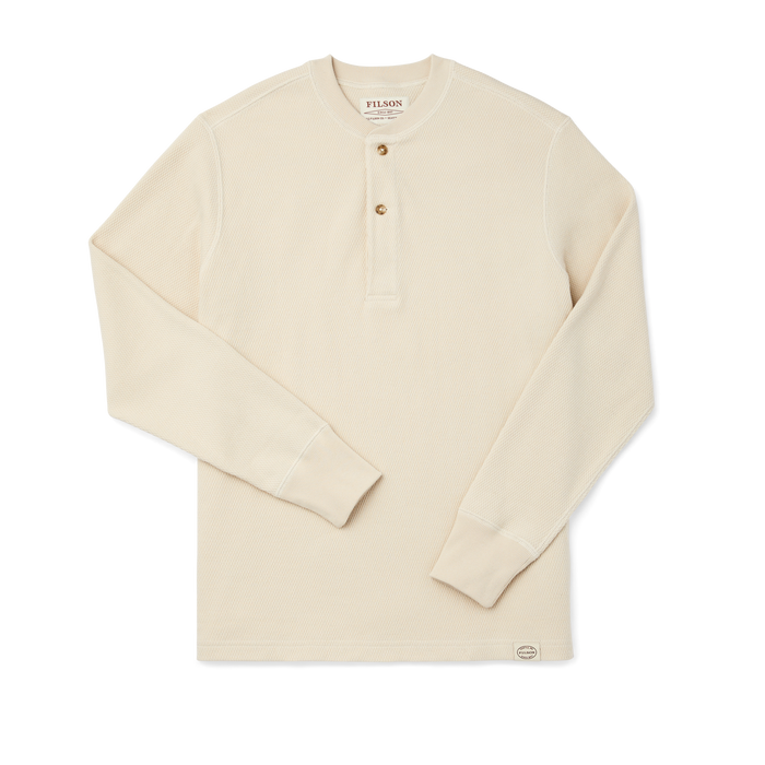 Cream waffle knit henley with long sleeves, two-button placket, and ribbed cuffs, flat lay view