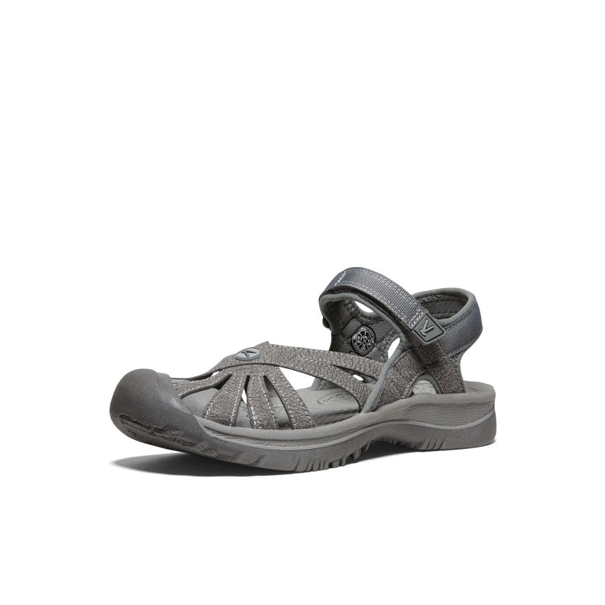 Gray women's sport sandal with adjustable straps and closed toe design, side view