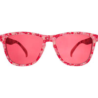 Pink floral patterned sunglasses with rose-tinted lenses on white background