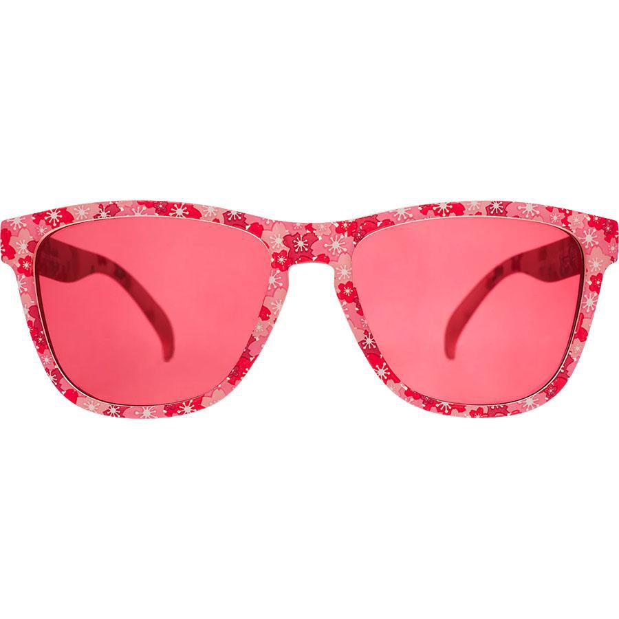 Pink floral patterned sunglasses with rose-tinted lenses on white background
