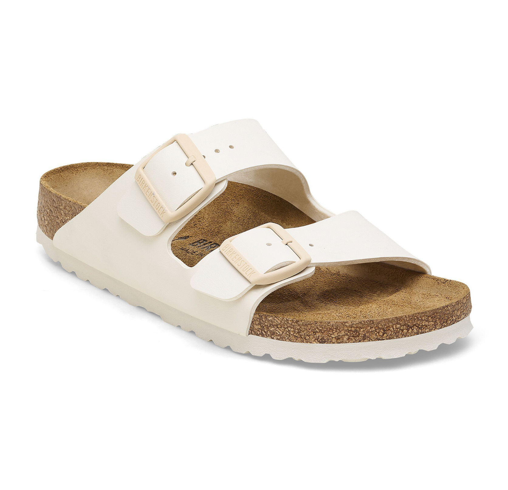 Two-strap slide sandal with adjustable buckles and cork footbed on white background