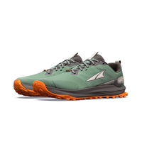 Trail running shoes with green mesh upper, orange lugged outsole, and gray laces, angled pair view