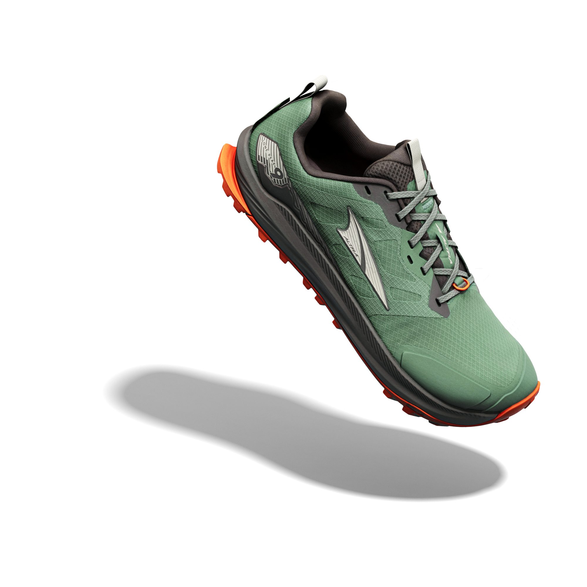 Trail running shoe in green with orange sole accents, three-quarter angle view showing lacing and tread