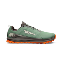 Men's trail running shoe with green mesh upper, orange lugged outsole, and gray midsole, lateral view