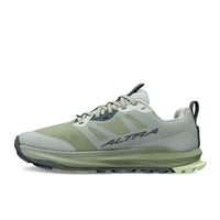Trail running shoe in light gray and green colorway, side profile view showing mesh upper and lugged outsole