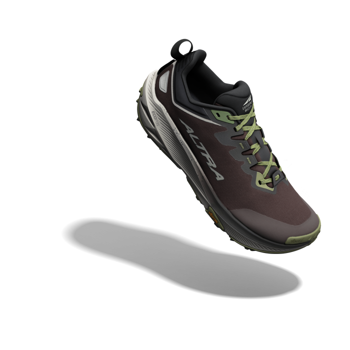Trail running shoe with taupe upper, gray midsole, olive green laces, and pull tab, angled side view