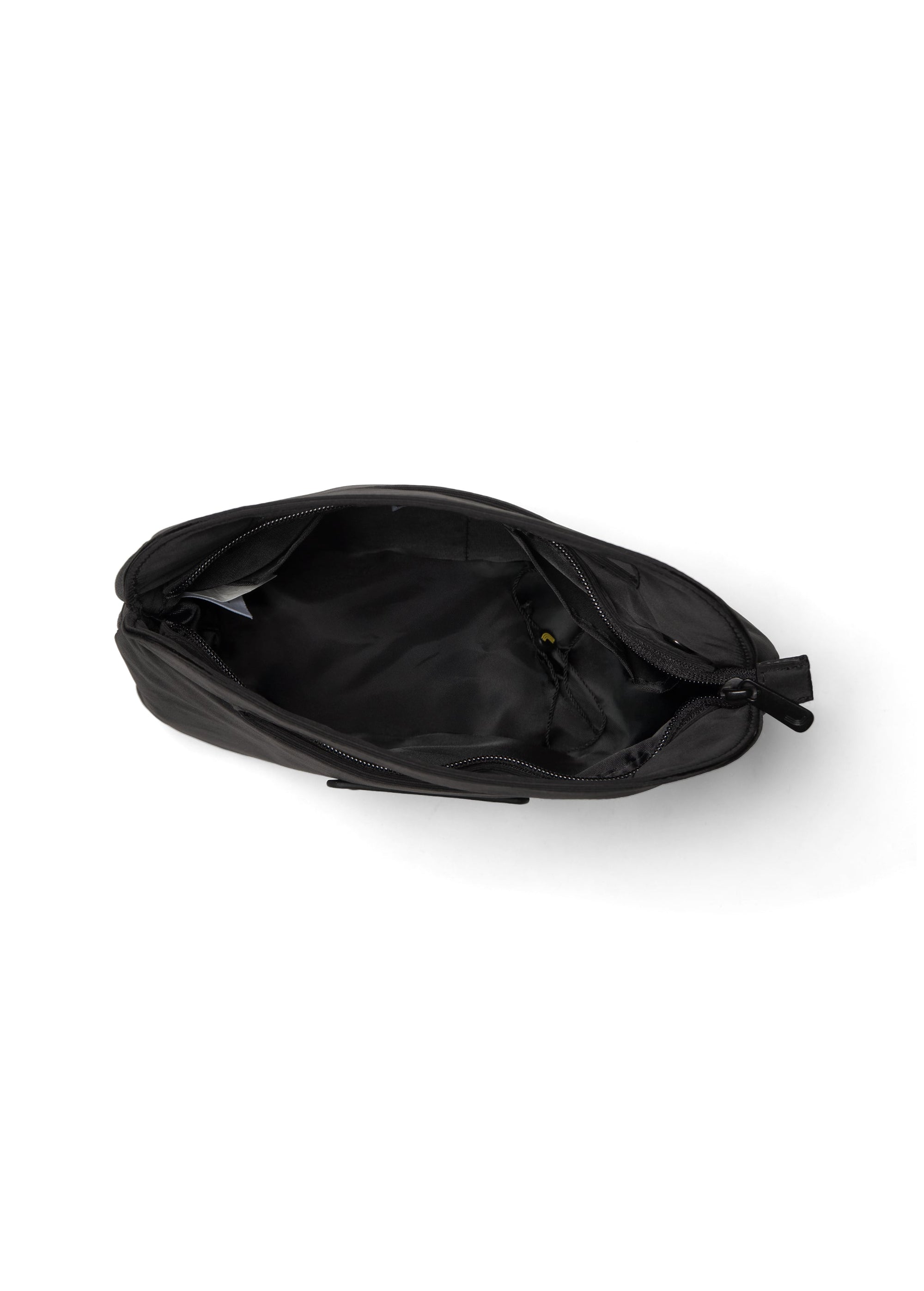 Black crossbody bag shown open from above, revealing interior compartment and zipper