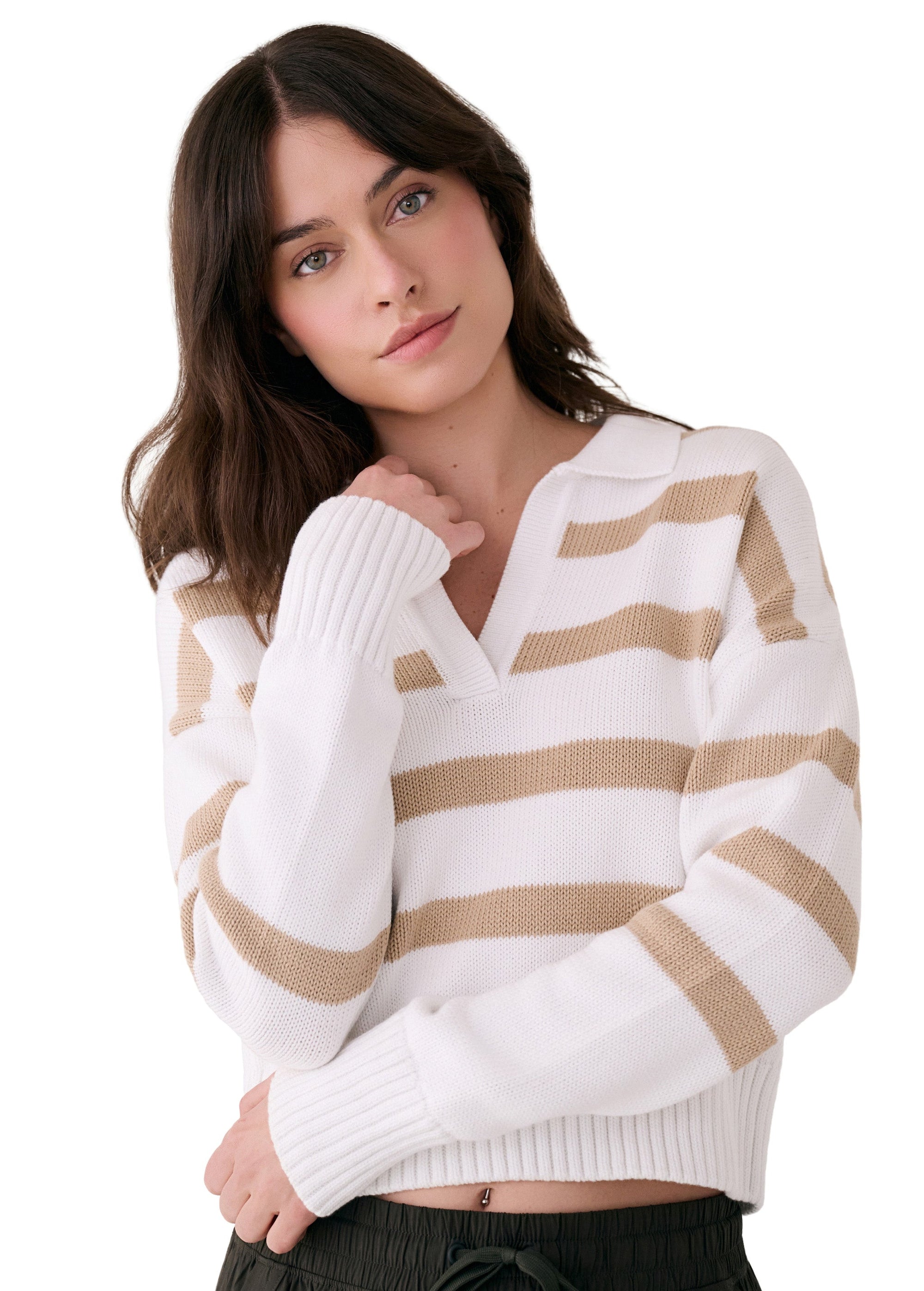 White striped polo sweater with v-neck and ribbed cuffs on model