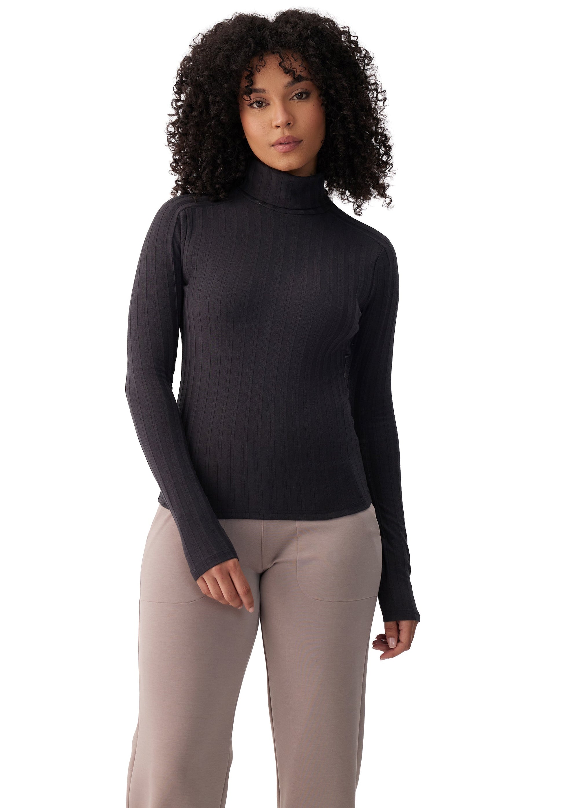Women's ribbed turtleneck long-sleeve top in black, front view on model