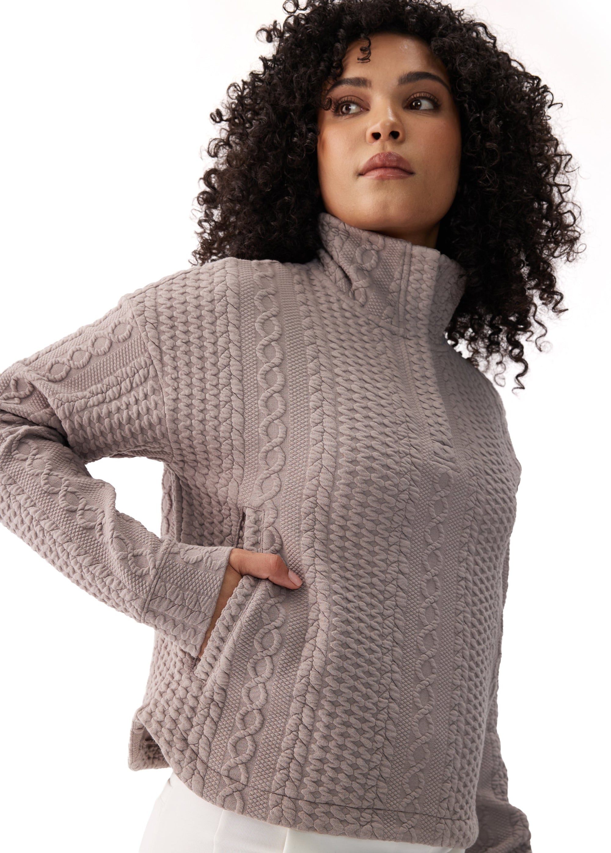 Women's cable-knit textured mock neck long sleeve pullover top, three-quarter front view