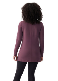Women's long-sleeve tunic top in plum purple, back view, with center seam detail and side slits