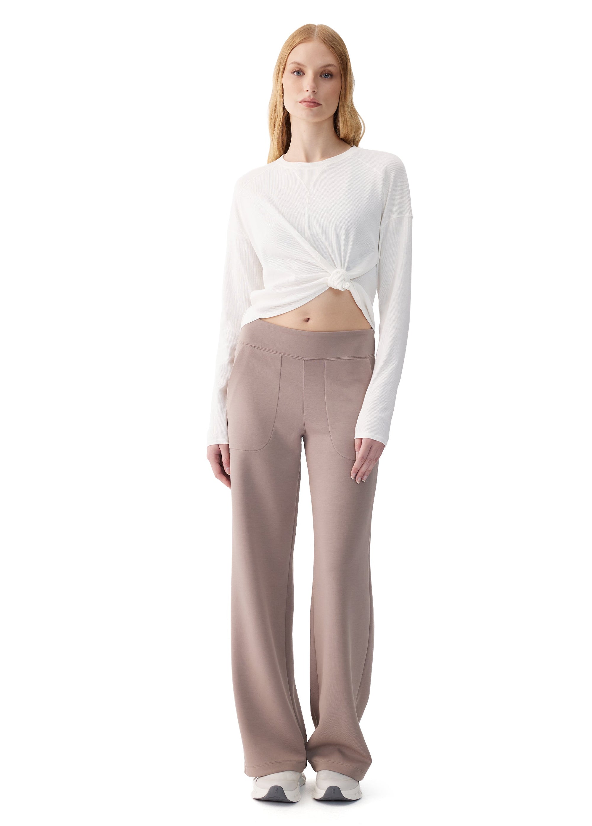 Wide-leg women's pants in taupe with seam detailing and pockets, front view on model
