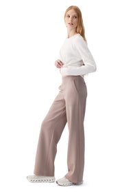 Wide-leg high-waist pants in taupe, side view on model with white long-sleeve top