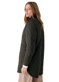 Women's quilted 3/4 length bomber jacket in dark olive, side view on model