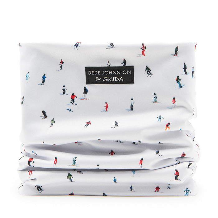 Folded neck warmer tube scarf with white fabric printed with tiny colorful skier figures