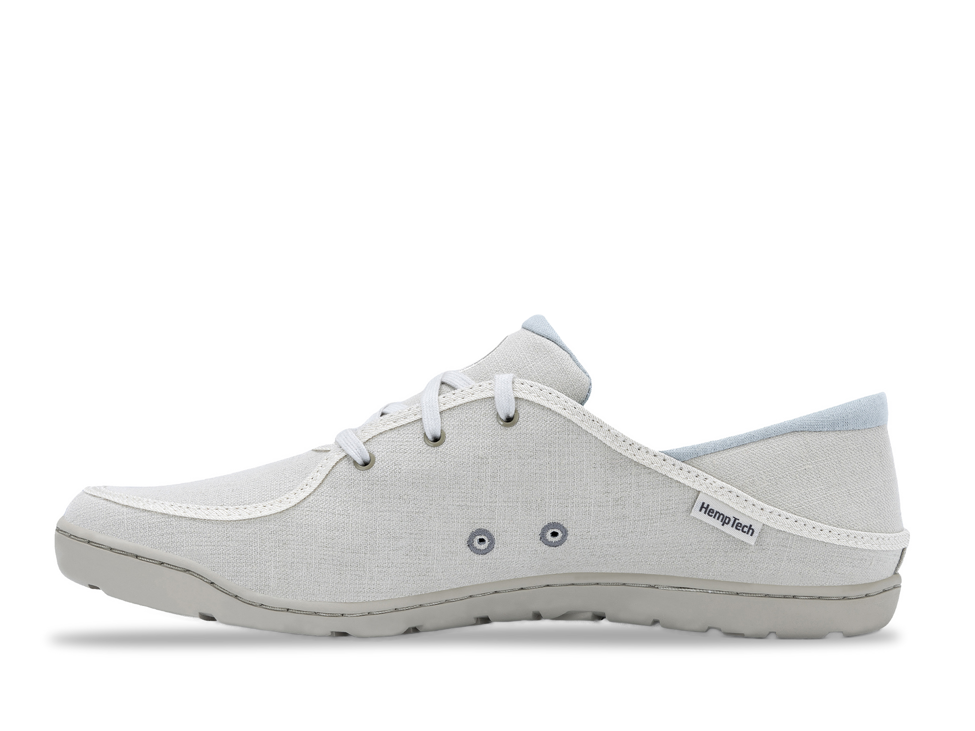 Light gray canvas casual shoe with white laces and rubber sole, side profile view