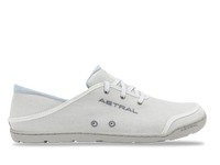 Light colored canvas sneaker with white laces and textured sole, side profile view