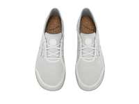 Light gray canvas sneakers with white laces and cork insoles, top-down view