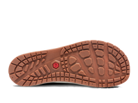 Bottom sole view of outdoor shoe showing brown rubber tread pattern with geometric grip design
