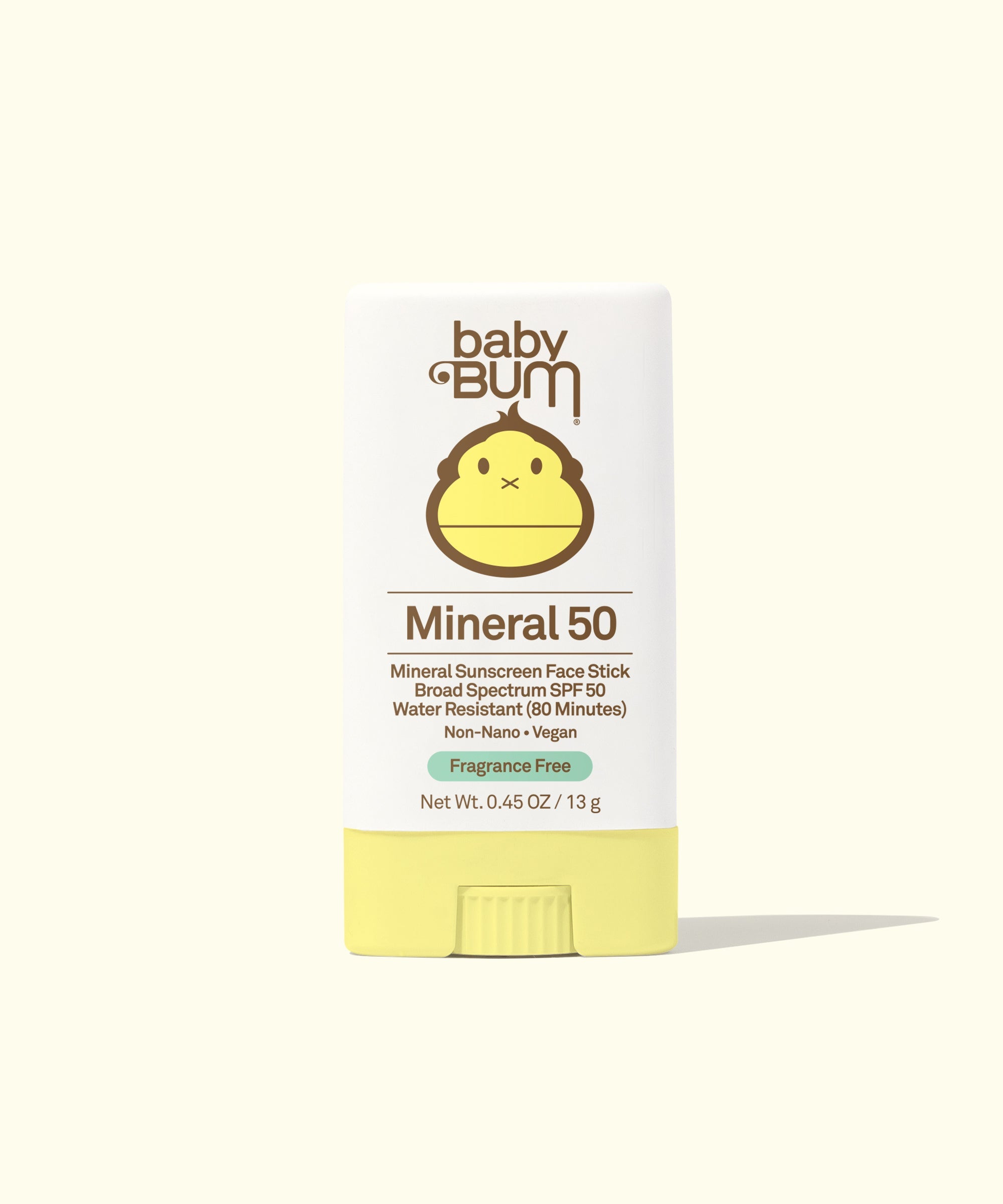 Yellow mineral sunscreen face stick in packaging with cute monkey mascot design
