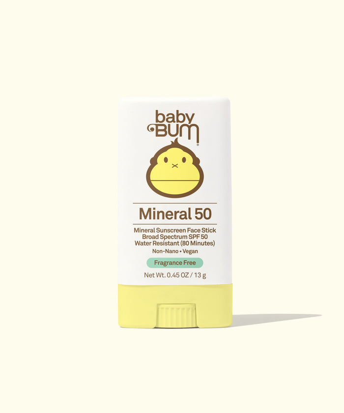 Yellow mineral sunscreen face stick in packaging with cute monkey mascot design
