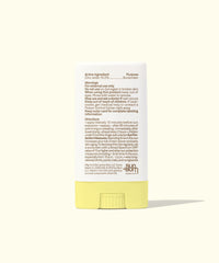 Yellow mineral sunscreen face stick showing product label and ingredients on clean background