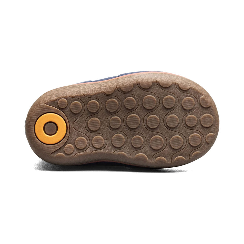 Bottom view of a baby boot showing brown rubber sole with circular tread pattern and orange accent