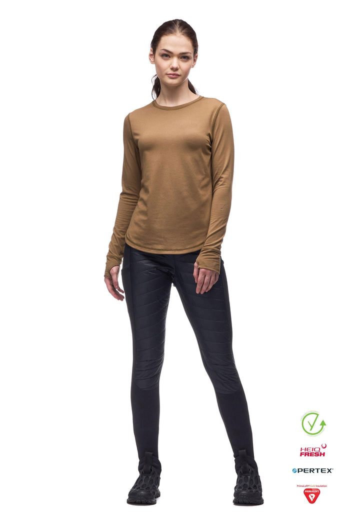 Women's black quilted insulated slim-fit pants with textured panels, front view on model