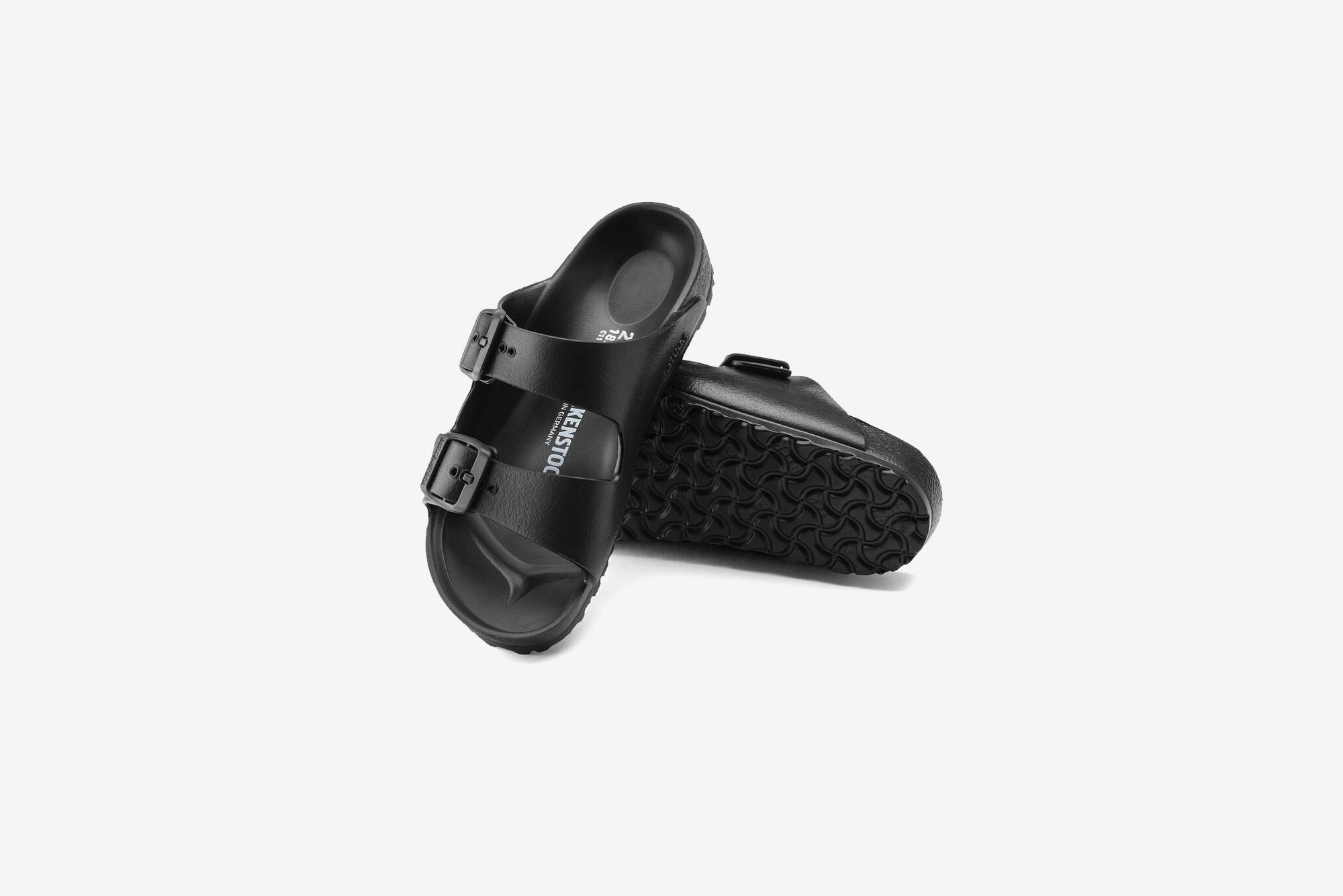 Black two-strap sandals with adjustable buckles and textured footbed, shown from above