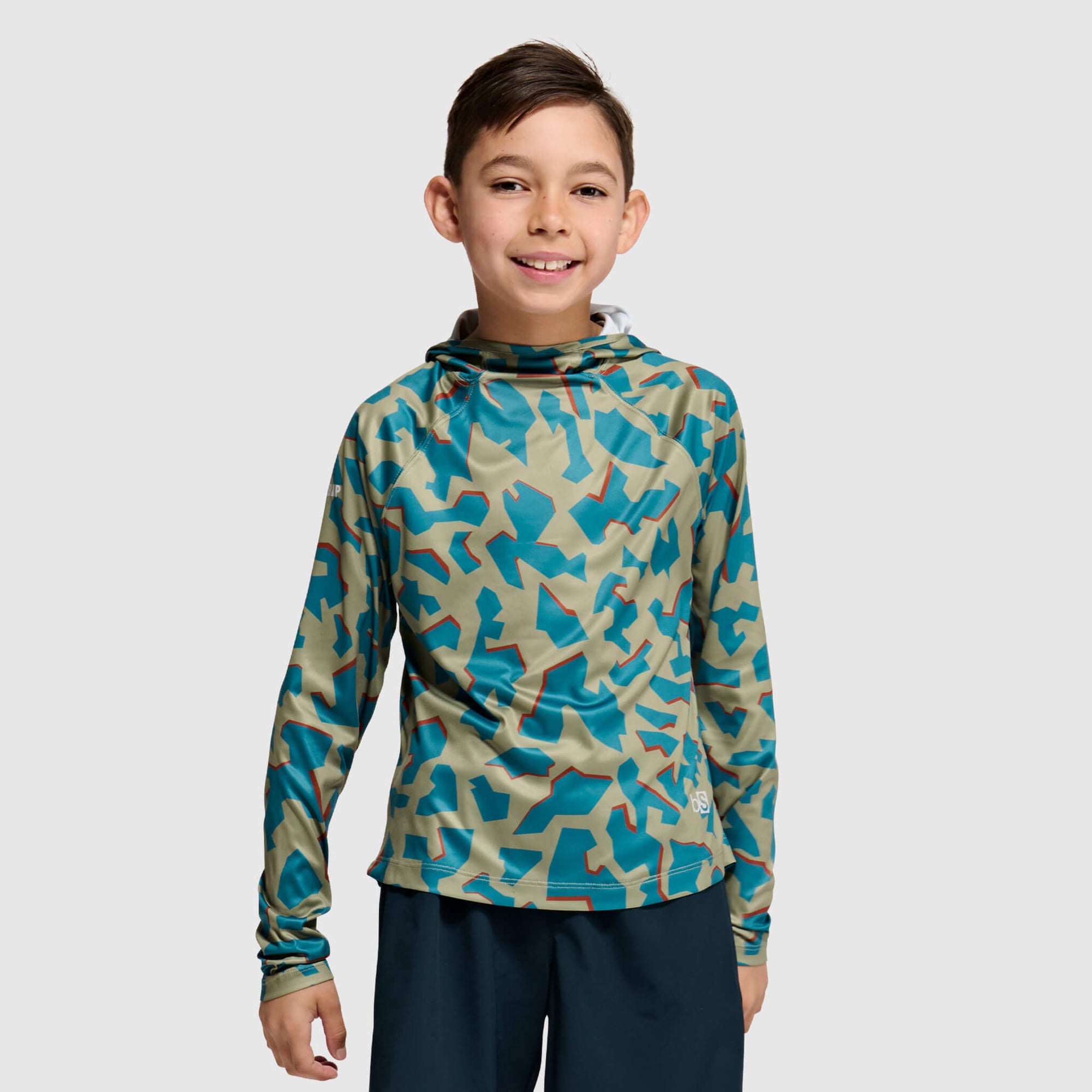 Child wearing blue and beige camouflage hooded long-sleeve shirt, front view