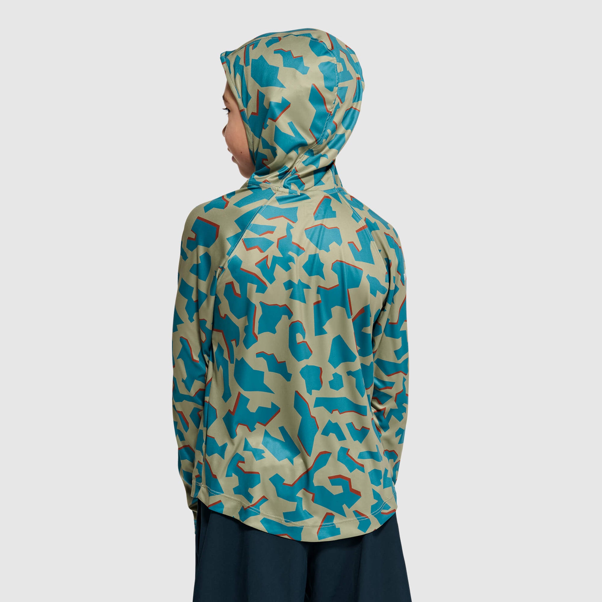 Child wearing camouflage hoodie with blue and green pattern, shown from back view