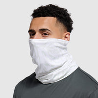 White textured neck gaiter worn by person against neutral background, side angle view