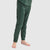 Green topographic pattern base layer pants shown from side angle on model legs
