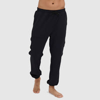 Black jogger pants with drawstring waist and elastic cuffs, worn by model standing