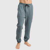 Men's jogger pants with drawstring waist and cuffed ankles, side view on model