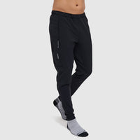 Black slim-fit athletic pants with side zip pocket, shown on model with athletic socks