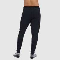 Men's slim-fit athletic pants in black, back view showing elastic waistband and tapered leg