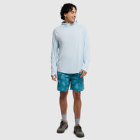 Light blue hooded long sleeve shirt with cowl neck, modeled by man in teal shorts