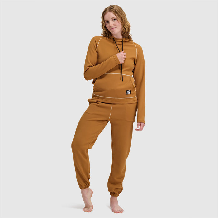 Women's jogger pants in warm tan with elasticized cuffs and waistband, full front view on model