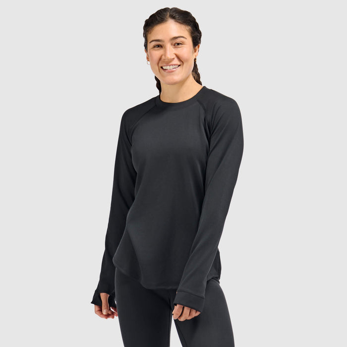 Women's long-sleeve crewneck base layer top in black, front view on model